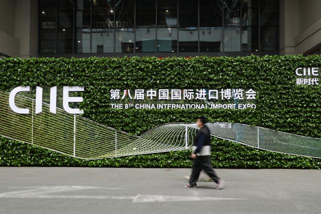 (251104) -- SHANGHAI, Nov. 4, 2025 (Xinhua) -- People walk at the National Exhibition and Convention Center (Shanghai), the main venue for the eighth China International Import Expo (CIIE), in east China's Shanghai, Nov. 4, 2025. The eighth CIIE will be held in Shanghai from Nov. 5 to 10. (Xinhua/Wang Jingqiang)