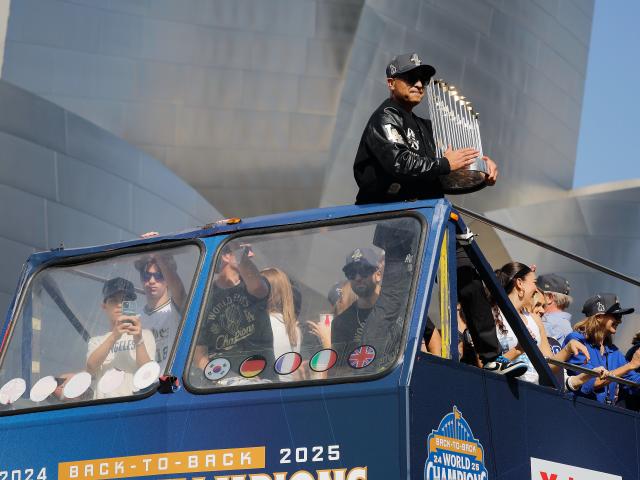 (251104) -- LOS ANGELES, Nov. 4, 2025 (Xinhua) -- Manager of Los Angeles Dodgers Dave Roberts celebrates during the Los Angeles Dodgers' victory parade in Los Angeles, California, the United States, on Nov. 3, 2025. On Saturday, the Dodgers clinched the 2025 MLB World Series title with a victory over the Toronto Blue Jays. (Photo by Qiu Chen/Xinhua)