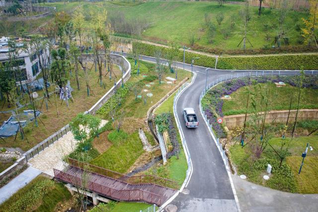 (251104) -- CHENGDU, Nov. 4, 2025 (Xinhua) -- An aerial drone photo taken on Nov. 4, 2025 shows a giant panda transported by a vehicle for accommodation at the Mianyang base of China Conservation and Research Center for the Giant Panda in Mianyang City, southwest China's Sichuan Province. The Mianyang base of China Conservation and Research Center for the Giant Panda, which took three years to build, was put into trial operation on Tuesday. Thirteen pandas from Wolong Shenshuping and Dujiangyan bases of China Conservation and Research Center for the Giant Panda moved into their new home at the newly opened Mianyang base on the day.
   The Mianyang giant panda base, covering an area of about 120 hectares, is located at an ecological park in Mianyang City. The base boasts more than 50 sets of giant panda enclosures with beautiful environment and meeting the requirements of giant panda breeding. (Xinhua)