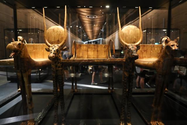 (251104) -- CAIRO, Nov. 4, 2025 (Xinhua) -- This photo taken on Nov. 4, 2025 shows funerary couches exhibited at the King Tutankhamun exhibition hall of the Grand Egyptian Museum in Giza, Egypt. The Grand Egyptian Museum (GEM) , the world's largest museum dedicated to a single civilization, opened to the public on Tuesday. (Xinhua/Sui Xiankai)