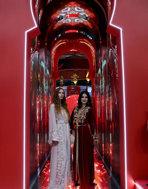 (251104) -- LONDON, Nov. 4, 2025 (Xinhua) -- Models pose for photos at the booth of Morocco during the World Travel Market (WTM) London 2025 in London, Britain, Nov. 4, 2025. The WTM London 2025 opened on Tuesday and will continue until Thursday. (Xinhua/Li Ying)