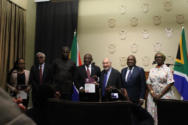 (251104) -- CAPE TOWN, Nov. 4, 2025 (Xinhua) -- South African President Cyril Ramaphosa (4th R) receives the G20 Extraordinary Committee Report on Global Inequality from Nobel Laureate Joseph Stiglitz (3rd R), UNAIDS Executive Director Winnie Byanyima (1st R), and four other leading global experts of the committee at a ceremony in Cape Town, South Africa, on Nov. 4, 2025. A G20 report commissioned under South Africa's presidency has sounded the alarm over an escalating global inequality crisis, calling for the creation of a new international panel to guide policymaking at both national and global levels. (Photo by Shakirah Thebus/Xinhua)