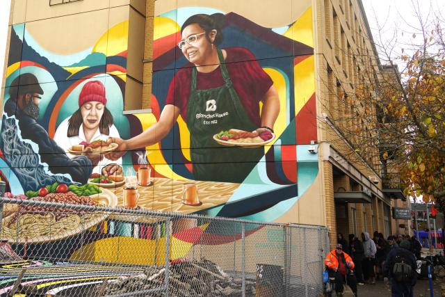 (251104) -- PORTLAND, Nov. 4, 2025 (Xinhua) -- People are seen waiting to receive free food on the street in Portland, Oregon, the United States, Nov. 4, 2025. The U.S. Senate on Tuesday again failed to pass a temporary funding bill, marking the 14th unsuccessful attempt. This means the federal government shutdown is on track to surpass the 35-day record set during the 2018-2019 shutdown and become the longest in U.S. history. (Xinhua/Wu Xiaoling)