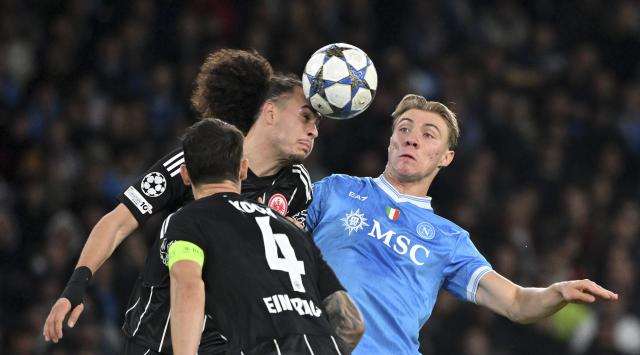 (251105) -- NAPLES, Nov. 5, 2025 (Xinhua) -- Napoli's Rasmus Hojlund (back R) vies with Frankfurt's Robin Koch (front) and Arthur Theate during the UEFA Champions League football match between Napoli and Frankfurt in Naples, Italy, on Nov. 4, 2025. (Photo by Alberto Lingria/Xinhua)