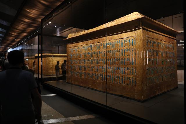 (251105) -- GIZA, Nov. 5, 2025 (Xinhua) -- This photo taken on Nov. 4, 2025 shows a gilded shrine at the King Tutankhamun exhibition hall of the Grand Egyptian Museum in Giza, Egypt.
  The Grand Egyptian Museum (GEM) opened its doors to the public on Tuesday, establishing itself as one of the world's largest displays of ancient relics, and a high-tech fort dedicated to heritage conservation.
  The main galleries display thousands of previously stored antiquities for the first time, housing the complete collection of some 5,992 artifacts from the tomb of the boy-king Tutankhamun. (Xinhua/Sui Xiankai)