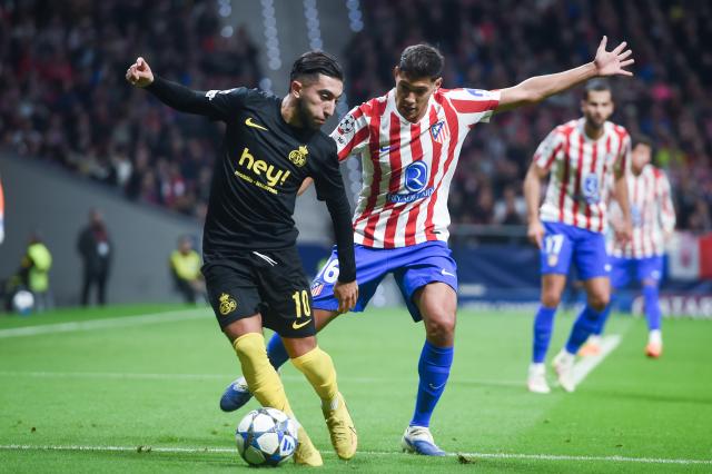 (251105) -- MADRID, Nov. 5, 2025 (Xinhua) -- Nahuel Molina (R) of Atletico de Madrid vies with Anouar Ait El Hadj Union Saint-Gilloise during the UEFA Champions League football match between Atletico de Madrid and Union Saint-Gilloise in Madrid, Spain, on Nov. 4, 2025. (Photo by Gustavo Valiente/Xinhua)