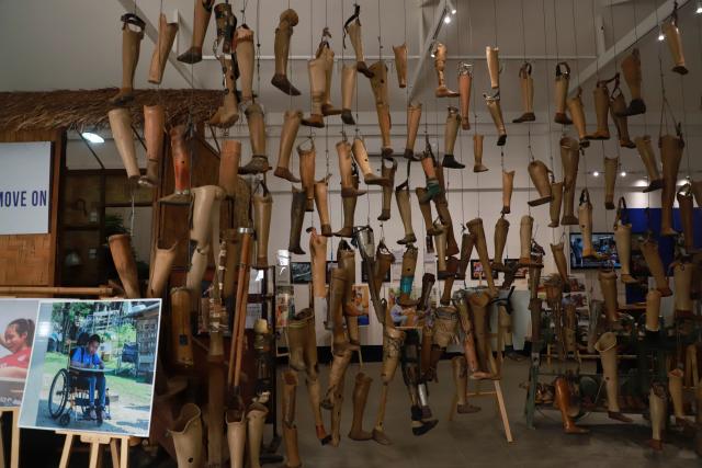 (251106) -- VIENTIANE, Nov. 6, 2025 (Xinhua) -- This photo taken on Nov. 6, 2025 shows the artificial limbs displayed in the Cooperative Orthotic and Prosthetic Enterprise (COPE), also known as the COPE Visitor Center, in Vientiane, Laos. The Cooperative Orthotic and Prosthetic Enterprise, located in Vientiane, capital of Laos, displays various prosthetics and war remnants such as bomb shells, documenting the damage caused by wars and unexploded ordnance to Laos. (Photo by Phouthaphone/Xinhua)