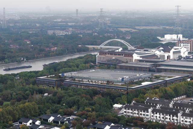 (251106) -- TONGXIANG, Nov. 6, 2025 (Xinhua) -- This photo taken on Nov. 5, 2025 shows the Wuzhen Internet International Exhibition & Convention Center, a venue of the 2025 World Internet Conference Wuzhen Summit, in Wuzhen, east China's Zhejiang Province. The 2025 World Internet Conference Wuzhen Summit kicked off here on Thursday, with a focus on building a community with a shared future in cyberspace, according to its organizers. (Xinhua/Huang Zongzhi)