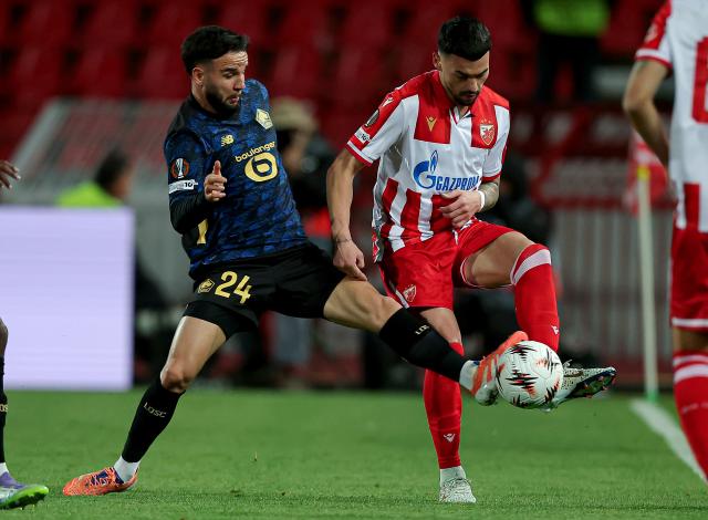 (251107) -- BELGRADE, Nov. 7, 2025 (Xinhua) -- Crvena Zvezda's Nemanja Radonjic (R) vies with LOSC Lille's Calvin Verdonk during the UEFA Europa League football match between Crvena Zvezda and LOSC Lille in Belgrade, Serbia, on Nov. 6, 2025. (Photo by Predrag Milosavljevic/Xinhua)