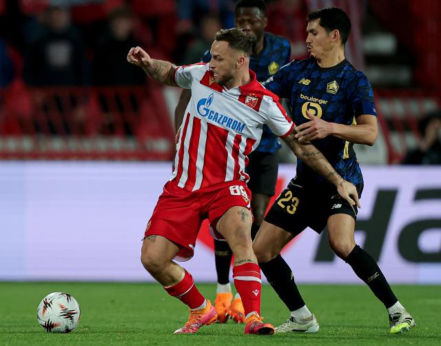 (251107) -- BELGRADE, Nov. 7, 2025 (Xinhua) -- Crvena Zvezda's Marko Arnautovic (L) vies with LOSC Lille's Aissa Mandi during the UEFA Europa League football match between Crvena Zvezda and LOSC Lille in Belgrade, Serbia, on Nov. 6, 2025. (Photo by Predrag Milosavljevic/Xinhua)