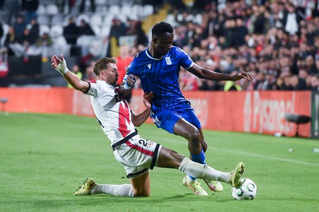 (251107) -- MADRID, Nov. 7, 2025 (Xinhua) -- Florian Lejeune (L) of Rayo Vallecano vies with Yannick Agnero of Lech Poznan during the round 3 match between Rayo Vallecano and Lech Poznan at the 2025-2026 UEFA Europa Conference League in Madrid, Spain, Nov. 6, 2025. (Photo by Gustavo Valiente/Xinhua)