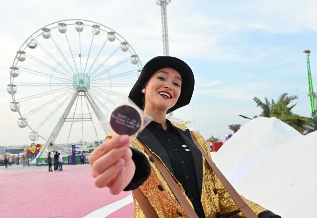 (251107) -- HAWALLI GOVERNORATE, Nov. 7, 2025 (Xinhua) -- A performer welcomes visitors at "Winter Wonderland Kuwait" in Hawalli Governorate, Kuwait, Nov. 6, 2025. "Winter Wonderland Kuwait", one of the largest entertainment projects in the country, opened its fourth season here on Thursday. (Photo by Asad/Xinhua)