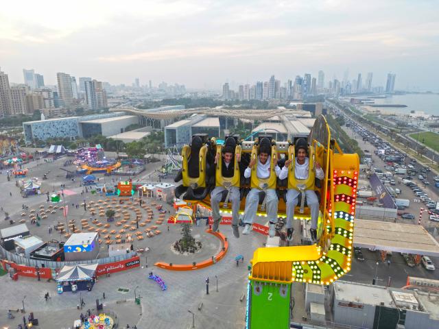 (251107) -- HAWALLI GOVERNORATE, Nov. 7, 2025 (Xinhua) -- Visitors enjoy their time at "Winter Wonderland Kuwait" in Hawalli Governorate, Kuwait, Nov. 6, 2025. "Winter Wonderland Kuwait", one of the largest entertainment projects in the country, opened its fourth season here on Thursday. (Photo by Asad/Xinhua)