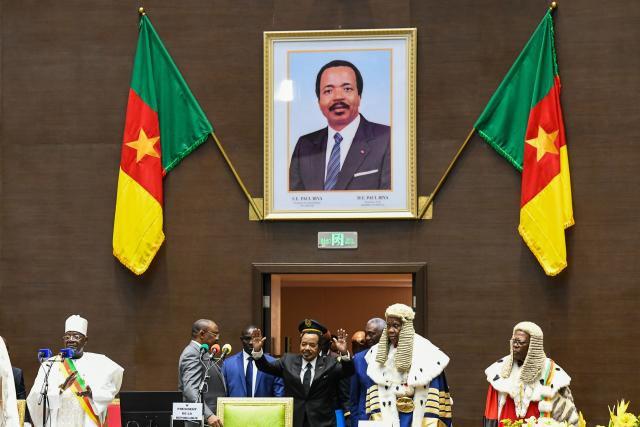 (251107) -- BEIJING, Nov. 7, 2025 (Xinhua) -- Cameroonian President Paul Biya (C) gestures as he arrives for the sworn-in ceremony in Yaounde, capital of Cameroon, Nov. 6, 2025. Cameroonian President Paul Biya was sworn in on Thursday for a new seven-year term after winning 53.66 percent of the vote in the country's Oct. 12 presidential election. (Xinhua/Kepseu)
