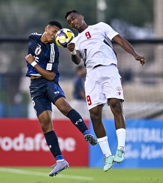 (251107) -- DOHA, Nov. 7, 2025 (Xinhua) -- Mendy Simon Yu (L) of Japan vies with Wesley Bouaoui of New Caledonia during the FIFA U-17 World cup Qatar 2025 group B match between Japan and New Caledonia in Doha, Qatar, on Nov. 6, 2025. (Photo by Nikku/Xinhua)