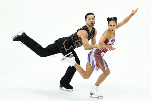 (251107) -- OSAKA, Nov. 7, 2025 (Xinhua) -- Lilah Fear/Lewis Gibson (L) of Britain perform during the ice dance rhythm dance at ISU Figure Skating Grand Prix 2025 in Osaka, Japan, Nov. 7, 2025. (Xinhua/Jia Haocheng)