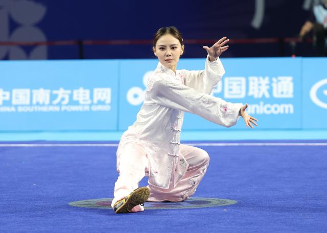 (251107) -- GUANGZHOU, Nov. 7, 2025 (Xinhua) -- Liang Biying of Guangdong competes during the women's Taijiquan-Taijijian of Wushu Taolu event at China's 15th National Games in Guangzhou, south China's Guangdong Province, Nov. 7, 2025. (Xinhua/Yang Shiyao)
