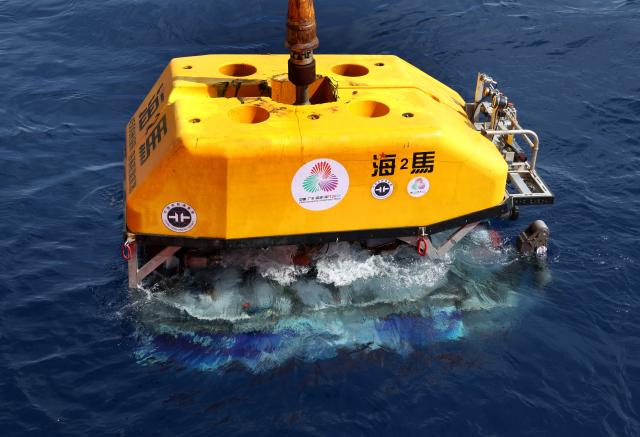 (251107) -- GUANGZHOU, Nov. 7, 2025 (Xinhua) -- Haima, a deep-sea remotely operated vehicle (ROV), is deployed to obtain the source of the flame for the 15th National Games from the ultra-deep seabed of the South China Sea, Sept. 18, 2025. (Xinhua/Lu Hanxin)