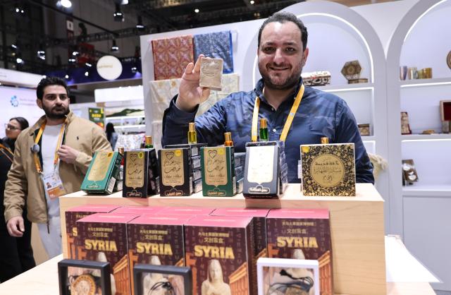 (251107) -- SHANGHAI, Nov. 7, 2025 (Xinhua) -- An exhibitor shows soaps from Syria at the Consumer Goods exhibition area of the eighth China International Import Expo (CIIE) in east China's Shanghai, Nov. 7, 2025. The eighth CIIE opened here on Wednesday. Enterprises from a total of 123 Belt and Road partner countries participated in this year's CIIE, increasing by 23.1 percent year on year. (Xinhua/Fang Zhe)