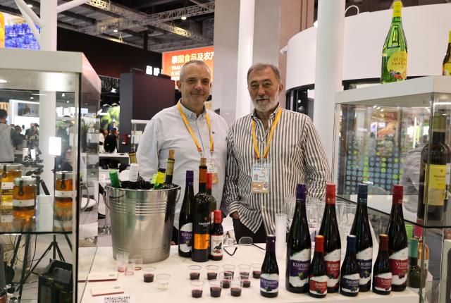 (251107) -- SHANGHAI, Nov. 7, 2025 (Xinhua) -- This photo shows bottles of wine from Serbia at the Food and Agricultural Products exhibition area during the eighth China International Import Expo in east China's Shanghai, Nov. 7, 2025. The eighth CIIE opened here on Wednesday. Enterprises from a total of 123 Belt and Road partner countries participated in this year's CIIE, increasing by 23.1 percent year on year. (Xinhua/Fang Zhe)