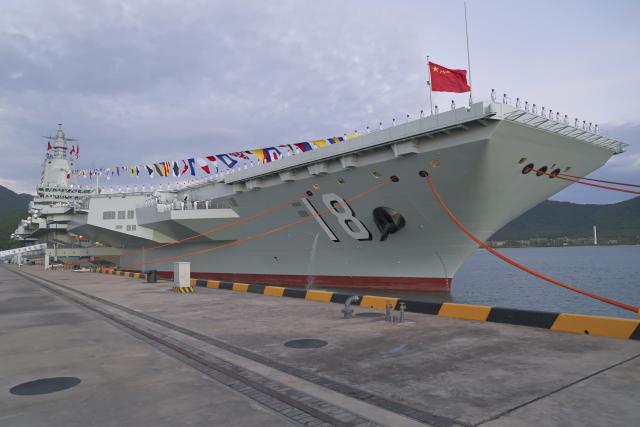 (251107) -- SANYA, Nov. 7, 2025 (Xinhua) -- The commissioning and flag-presenting ceremony of the Fujian, China's first aircraft carrier equipped with electromagnetic catapults, is held at a naval port in Sanya City, south China's Hainan Province, on Nov. 5, 2025. The Fujian was launched in June 2022 and named after Fujian Province. (Xinhua/Li Gang)