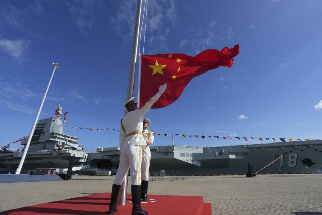 (251107) -- SANYA, Nov. 7, 2025 (Xinhua) -- The commissioning and flag-presenting ceremony of the Fujian, China's first aircraft carrier equipped with electromagnetic catapults, is held at a naval port in Sanya City, south China's Hainan Province, on Nov. 5, 2025. The Fujian was launched in June 2022 and named after Fujian Province. (Xinhua/Li Gang)