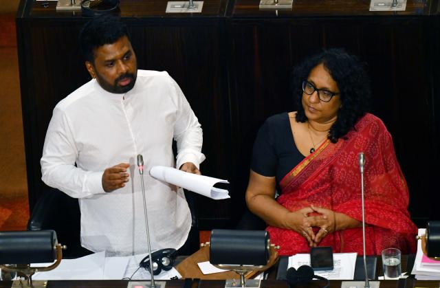 (251107) -- COLOMBO, Nov. 7, 2025 (Xinhua) -- Sri Lankan President and Finance Minister Anura Kumara Dissanayake (L) delivers a speech on the country's 2026 budget in Colombo, Sri Lanka, Nov. 7, 2025. Sri Lanka has announced a series of measures to strengthen digitalization and modernization of public administration under the 2026 national budget presented in Parliament on Friday. (Photo by Ajith Perera/Xinhua)