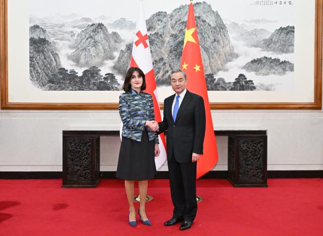 (251107) -- BEIJING, Nov. 7, 2025 (Xinhua) -- Chinese Foreign Minister Wang Yi, who is also a member of the Political Bureau of the Communist Party of China Central Committee, holds talks with Minister of Foreign Affairs of Georgia Maka Botchorishvili in Beijing, capital of China, Nov. 7, 2025. (Xinhua/Dai Tianfang)
