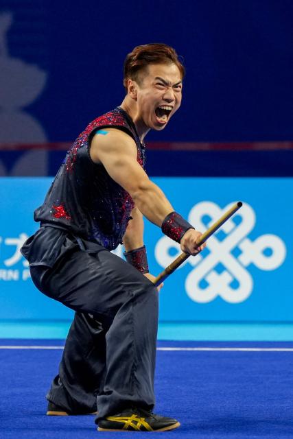 (251108) -- GUANGZHOU, Nov. 7, 2025 (Xinhua) -- Li Jianming of Beijing Sport University competes during the men's Nangun competition of Nanquan-Nandao-Nangun of Wushu Taolu event at China's 15th National Games in Guangzhou, south China's Guangdong Province, Nov. 7, 2025. (Xinhua/Jigme Dorji)