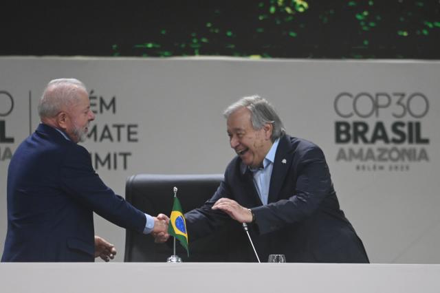 (251107) -- BELEM(BRAZIL), Nov. 7, 2025 (Xinhua) -- Brazilian President Luiz Inacio Lula da Silva (L) shakes hands with UN Secretary-General Antonio Guterres during the Belem Climate Summit ahead of the 30th Conference of the Parties (COP30) of the United Nations Framework Convention on Climate Change in Belem, Brazil, Nov. 6, 2025. (Photo by Lucio Tavora/Xinhua) UN Secretary-General Antonio Guterres and world leaders on Thursday urged governments to take immediate, decisive actions and make concerted efforts to combat climate change. (Photo by Lucio Tavora/Xinhua)