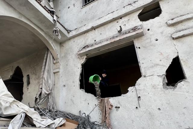 (251107) -- TAYR DEBBA(LEBANON), Nov. 7, 2025 (Xinhua) -- A woman cleans the rubble of a building destroyed by Israeli air raids a day earlier in the southern town of Tayr Debba, Lebanon on Nov. 7, 2025. (Photo by Ali Hashisho/Xinhua)