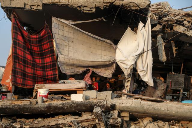 (251107) -- GAZA, Nov. 7, 2025 (Xinhua) -- Palestinians are seen after they returned to the destroyed Sheikh Radwan area, north of Gaza City, Nov. 6, 2025. (Photo by Rizek Abdeljawad/Xinhua)