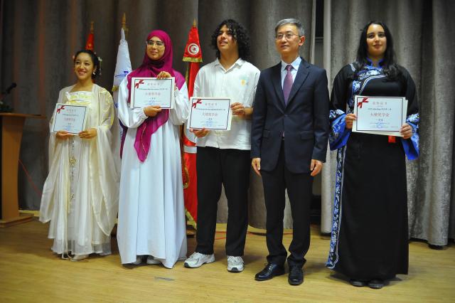 (251107) -- TUNIS, Nov. 7, 2025 (Xinhua) -- Chinese Ambassador to Tunisia Wan Li (2nd R) and some of the recipients pose for photos at the award ceremony of Chinese Ambassador Scholarships in Tunis, Tunisia, Nov. 7, 2025. Thirty-nine Tunisian high school students received Chinese Ambassador Scholarships on Friday in recognition of their participation in cultural exchanges between Tunisia and China, the Chinese embassy said. (Photo by Adel Ezzine/Xinhua)