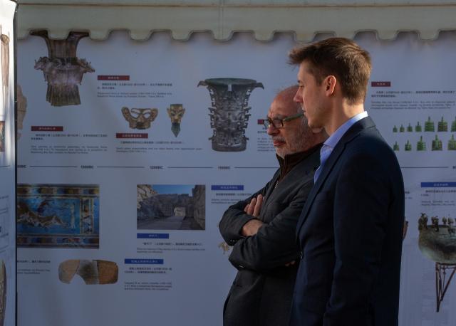 (251107) -- ATHENS, Nov. 7, 2025 (Xinhua) -- Scholars visit a photo exhibition at the Chinese School of Classical Studies (CSCSA) in Athens, Greece on Nov. 7, 2025. The Chinese School of Classical Studies (CSCSA) held a series of academic seminars and activities in Athens on Friday to mark its first anniversary, with scholars from China and Greece having exchanges on archaeological research and academic cooperation. (Photo by Marios Lolos/Xinhua)