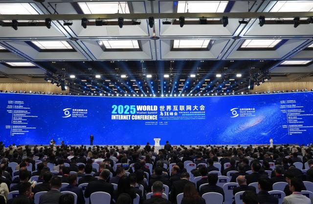 (251108) -- BEIJING, Nov. 8, 2025 (Xinhua) -- This photo taken on Nov. 7, 2025 shows a scene during the opening ceremony of the 2025 World Internet Conference (WIC) Wuzhen Summit in Wuzhen, east China's Zhejiang Province. The summit opened officially here on Friday and will run through Sunday. (Xinhua/Huang Zongzhi)
