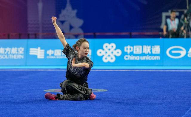 (251108) -- GUANGZHOU, Nov. 8, 2025 (Xinhua) -- Wang Yawen of Jiangsu competes during the Changquan competition of women's Changquan-Jianshu-Qiangshu of Wushu Taolu event at China's 15th National Games in Guangzhou, south China's Guangdong Province, Nov. 8, 2025. (Xinhua/Jigme Dorji)