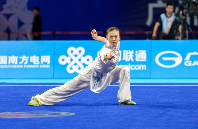 (251108) -- GUANGZHOU, Nov. 8, 2025 (Xinhua) -- Yang Kaige of Henan competes during the Changquan competition of women's Changquan-Jianshu-Qiangshu of Wushu Taolu event at China's 15th National Games in Guangzhou, south China's Guangdong Province, Nov. 8, 2025. (Xinhua/Jigme Dorji)