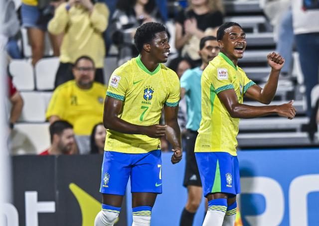 (251108) -- DOHA, Nov. 8, 2025 (Xinhua) -- Ruan Pablo (L) of Brazil celebrates with his teammate Kayke (R) after scoring during the group H match between Brazil and Indonesia of FIFA U17 World cup Qatar 2025 in Doha, Qatar, on Nov. 7, 2025. (Photo by Nikku/Xinhua)