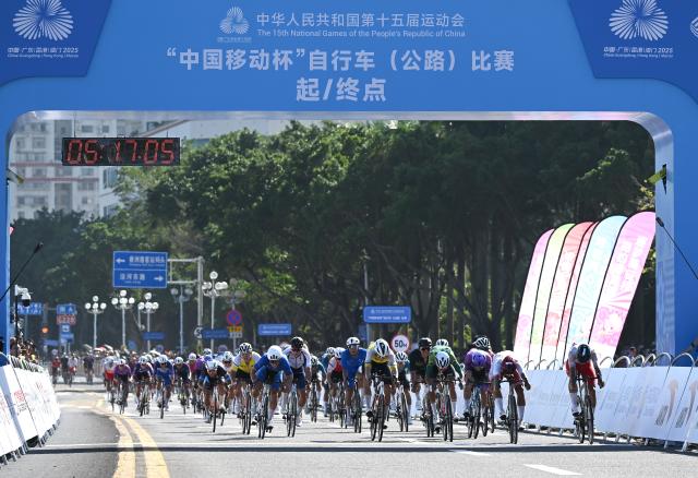 (251108) -- ZHUHAI, Nov. 8, 2025 (Xinhua) -- Cyclists cross the finish line during the men's road race of cycling road at China's 15th National Games in south China's Guangdong Province, Nov. 8, 2025. (Xinhua/Lian Zhen)