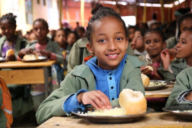 (251108) -- ADDIS ABABA, Nov. 8, 2025 (Xinhua) -- A girl benefiting from the "Smiling Children Program" poses for a photo at a primary school near Addis Ababa, capital of Ethiopia, on Sept. 30, 2025. TO GO WITH "Chinese charity celebrates 10th anniversary of school feeding program in Ethiopia" (China Foundation for Rural Development/Handout via Xinhua)