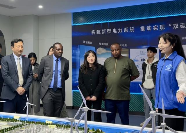 (251108) -- ZHENGZHOU, Nov. 8, 2025 (Xinhua) -- Paul Umukunzi (2nd L, front), director general of the Rwanda TVET Board, and staff members visit Zhengzhou Electric Power College in Zhengzhou, central China's Henan Province, Nov. 4, 2025. TO GO WITH "Across China: Rwandan next-generation engineers plug into China's power grid" (Xinhua)