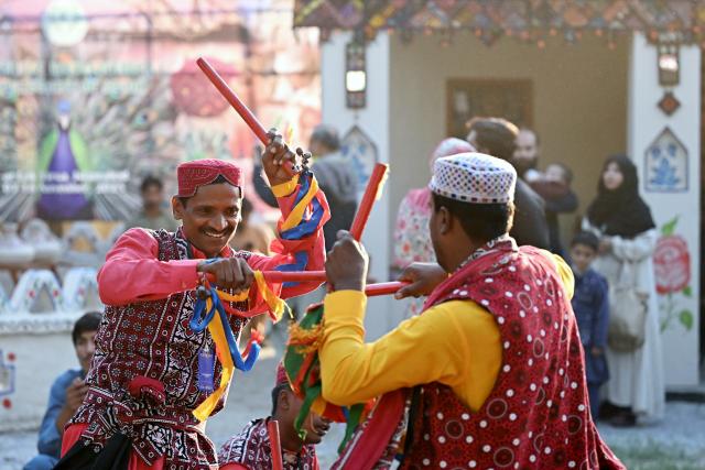 (251108) -- ISLAMABAD, Nov. 8, 2025 (Xinhua) -- Folk artists perform during the Lok Mela Festival in Islamabad, capital of Pakistan, Nov. 7, 2025. The annual ten-day folk festival kicked off here on Friday. (Photo by Ahmad Kamal/Xinhua)