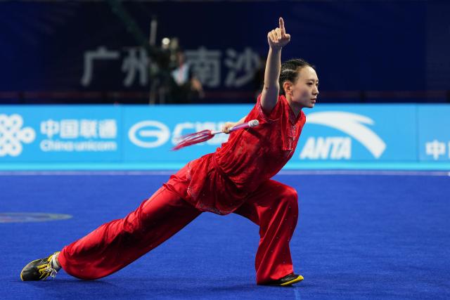 (251108) -- GUANGZHOU, Nov. 8, 2025 (Xinhua) -- Yao Yang of Shanxi competes during the Qiangshu competition of women's Changquan-Jianshu-Qiangshu of Wushu Taolu event at China's 15th National Games in Guangzhou, south China's Guangdong Province, Nov. 8, 2025. (Xinhua/Jigme Dorji)