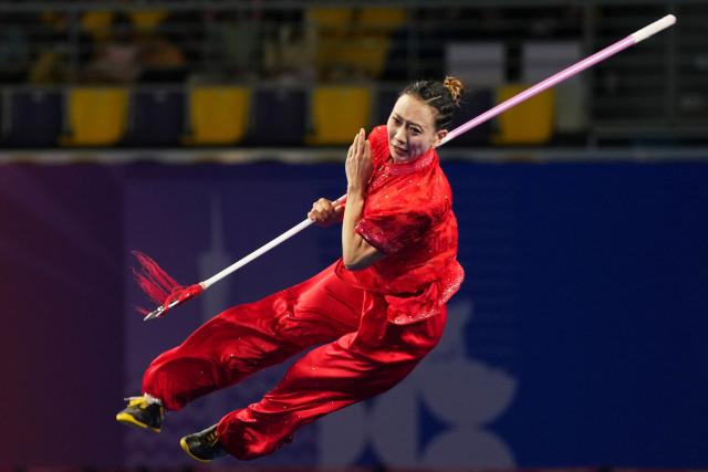 (251108) -- GUANGZHOU, Nov. 8, 2025 (Xinhua) -- Yao Yang of Shanxi competes during the Qiangshu competition of women's Changquan-Jianshu-Qiangshu of Wushu Taolu event at China's 15th National Games in Guangzhou, south China's Guangdong Province, Nov. 8, 2025. (Xinhua/Jigme Dorji)