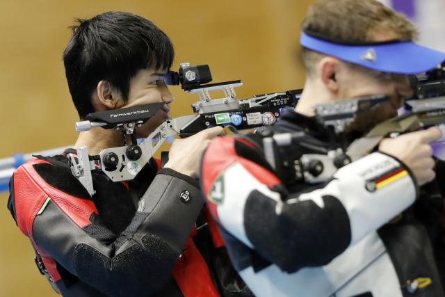 (251109) -- CAIRO, Nov. 9, 2025 (Xinhua) -- Sheng Lihao (L) of China competes during the 10m air rifle men's final of shooting at the 2025 ISSF World Championship Rifle/Pistol in Cairo, Egypt, on Nov. 8, 2025. (Xinhua/Ahmed Gomaa)