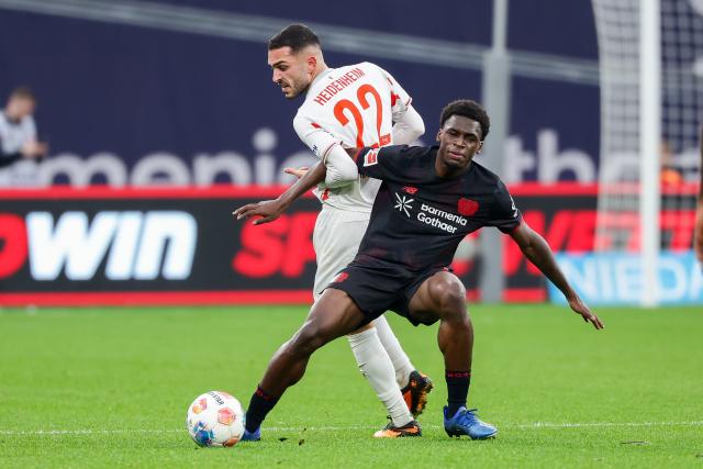 (251109) -- LEVERKUSEN, Nov. 9, 2025 (Xinhua) -- Ernest Poku (R) of Bayer 04 Leverkusen vies with Arijon Ibrahimovic of 1. FC Heidenheim 1846 during the German first division of Bundesliga football match between Bayer 04 Leverkusen and 1. FC Heidenheim 1846 in Leverkusen, Germany, Nov. 8. 2025. (Photo by Joachim Bywaletz/Xinhua)