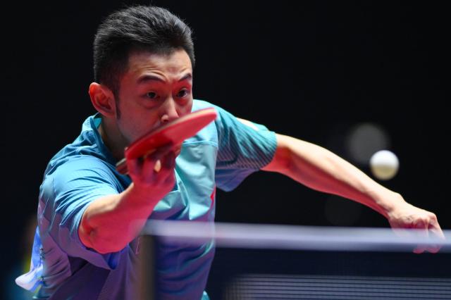 (251109) -- MACAO, Nov. 9, 2025 (Xinhua) -- Wong Chun Ting hits a return during the table tennis men's singles round of 32 match between Wong Chun Ting of Hong Kong and Zhao Zhaoyan of Shanghai at China's 15th National Games in Macao, south China, Nov. 9, 2025. (Xinhua/Cheong Kam Ka)