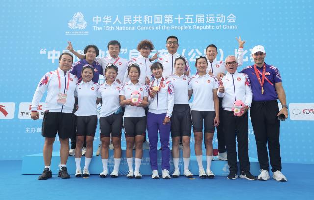 (251109) -- ZHUHAI, Nov. 9, 2025 (Xinhua) -- Team members of Hong Kong pose after the awarding ceremony for the women's road race of cycling road at China's 15th National Games in south China's Guangdong Province, Nov. 9, 2025. (Xinhua/Mao Siqian)