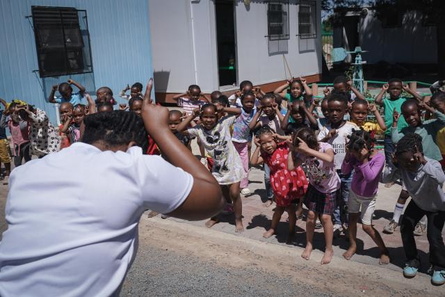 (251109) -- CAPE TOWN, Nov. 9, 2025 (Xinhua) -- A teacher interacts with children at an early childhood education center operated by Longyuan South Africa Renewables Ltd. in De Aar, Northern Cape, South Africa, Oct. 22, 2025.
  TO GO WITH "Feature: Chinese-built wind power project empowers locals, improves lives in South Africa" (Xinhua/Han Xu)