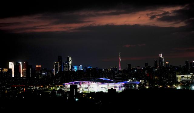 (251109) -- GUANGDONG, Nov. 9, 2025 (Xinhua) -- This photo taken on Nov. 9, 2025 shows the Guangdong Olympics Sports Center and the Canton Tower in Guangzhou, south China's Guangdong Province. The opening ceremony of China's 15th National Games will be held on Sunday evening in Guangzhou. (Xinhua/Jigme Dorji)